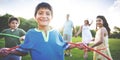 Whole Family Hula Hooping Outdoors Togetherness Concept