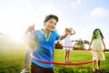 Whole Family Hula Hooping Outdoors Togetherness Concept