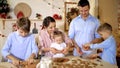 Whole family is making cookies together for Christmas. Royalty Free Stock Photo