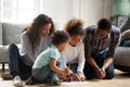 Whole family sitting on floor and drawing Royalty Free Stock Photo