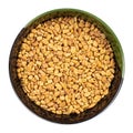 Whole fenugreek seeds in round bowl isolated Royalty Free Stock Photo