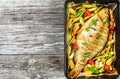 Whole fish baked in a baking dish, top view