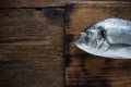 Whole fish, on wooden background Royalty Free Stock Photo