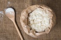 Whole flour and wooden spoon, top view