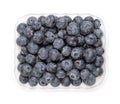 Whole fresh blueberries, ripe and dark blue fruits, in a clear plastic punnet