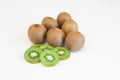 Whole fresh kiwi fruit and slices isolatet on white background with copy space for text Royalty Free Stock Photo