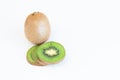 Whole fresh kiwi fruit and slices isolatet on white background with copy space for text Royalty Free Stock Photo