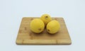 Group of ripe whole yellow lemon citrus fruit with lemon fruit half isolated on white background