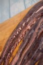 Whole fresh raw octopus on cutting board Royalty Free Stock Photo