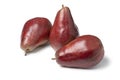 Whole fresh ripe Red Modoc pears on white background