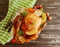 Whole fried chicken glazed, garlic homemade cooked on wooden background