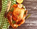 Whole fried chicken glazed prepared , tasty dinner cooked on wooden background