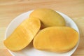 Whole Fruit and Cut in Half Aromatic Tasty Ripe Ok-Rong Mangoes of Thailand