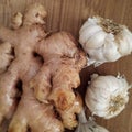 Whole garlic and ginger on the wooden table. Royalty Free Stock Photo
