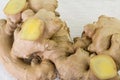 Whole ginger root and cut slices isolated on white Royalty Free Stock Photo