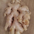 Whole ginger on the wooden table. Royalty Free Stock Photo