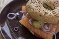 Whole Grain Bagel with salmon, cream cheese, onions and kosher pickle