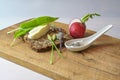 Whole grain bread with butter, radish, herb salt and wild garlic on a rustic wooden cutting board, simple healthy and natural meal Royalty Free Stock Photo