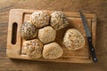 Whole grain bread on cutting board with knife. Royalty Free Stock Photo