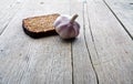 Whole grain brown bread and pungent garlic. Royalty Free Stock Photo