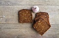 Whole grain brown bread and pungent garlic. Royalty Free Stock Photo