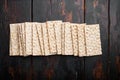 Whole grain crisp bread, on old dark  wooden table background, top view flat lay, with copy space for text Royalty Free Stock Photo