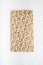 Whole grain crisp bread, on white stone table background, top view flat lay Royalty Free Stock Photo