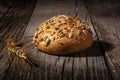 Whole grain, gluten free bread on a wooden table on a dark background Royalty Free Stock Photo