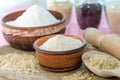 Whole grain rice flour in bowls. White rice red rice black. The whole grain of rice. Unpolished rice in wooden spoon. Healthy food Royalty Free Stock Photo