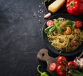 Whole grain spaghetti pasta with shrimp, top view, copy space