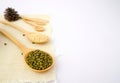 Whole grains such as mung beans, white sesame and barley on wooden spoon and sackcloth on white background. Royalty Free Stock Photo