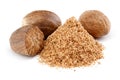 Whole and grated nutmeg on white