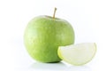 Whole green apple and a sliced one isolated on white background, close up Royalty Free Stock Photo