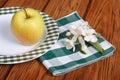 The whole green apple on a white plate Royalty Free Stock Photo