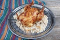 Whole grilled chicken on rice. Baked chicken stuffed with rice for Christmas dinner on a festive table Royalty Free Stock Photo