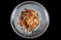 Whole grilled chicken on rice. Baked chicken stuffed with rice for Christmas dinner on a festive table Royalty Free Stock Photo