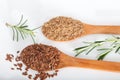 Whole and ground brown flax seeds or linseeds Royalty Free Stock Photo