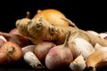 Whole group pile ingredient of fresh onion garlic ginger  isolated on black background Royalty Free Stock Photo