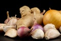 Whole group pile ingredient of fresh onion garlic ginger  isolated on black background Royalty Free Stock Photo