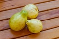 Whole guava fruits on wooden table