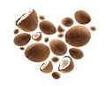 Whole and half cocoanuts in the shape of a heart on a white background