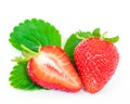 Whole and half cut strawberries and leaves isolated on a white