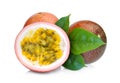 Whole and half of passion fruit with green leaves isolated Royalty Free Stock Photo