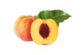 Whole and half peach with stone and leaf isolated Royalty Free Stock Photo