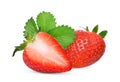 whole and half of red strawberry with green leaves isolated Royalty Free Stock Photo