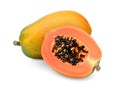 Whole and half of ripe papaya fruit with seeds isolated on white Royalty Free Stock Photo