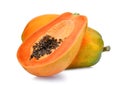 Whole and half of ripe papaya fruit with seeds on white Royalty Free Stock Photo