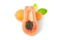 Whole and half of ripe papaya fruit with seeds on white background Royalty Free Stock Photo