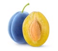 Whole and halved blue plums with a seed isolated on white Royalty Free Stock Photo