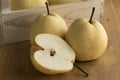 Whole and halved fresh chinese pear Royalty Free Stock Photo